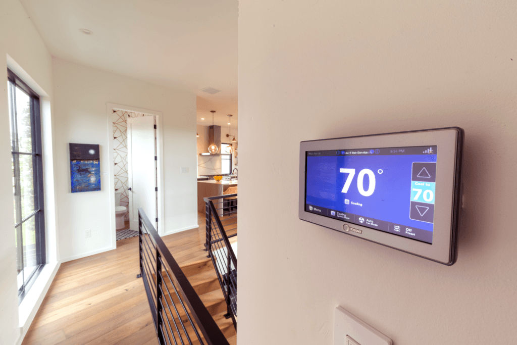 Trane smart thermostat on the interior wall of a home