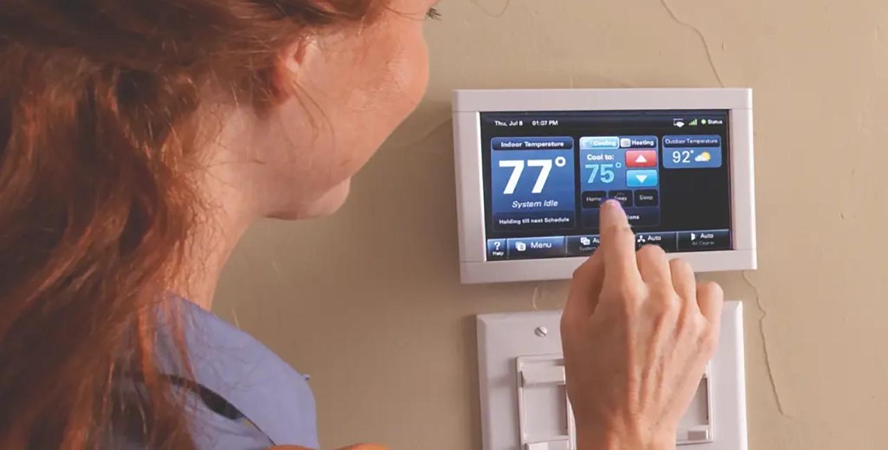 smart thermostats woman at controls